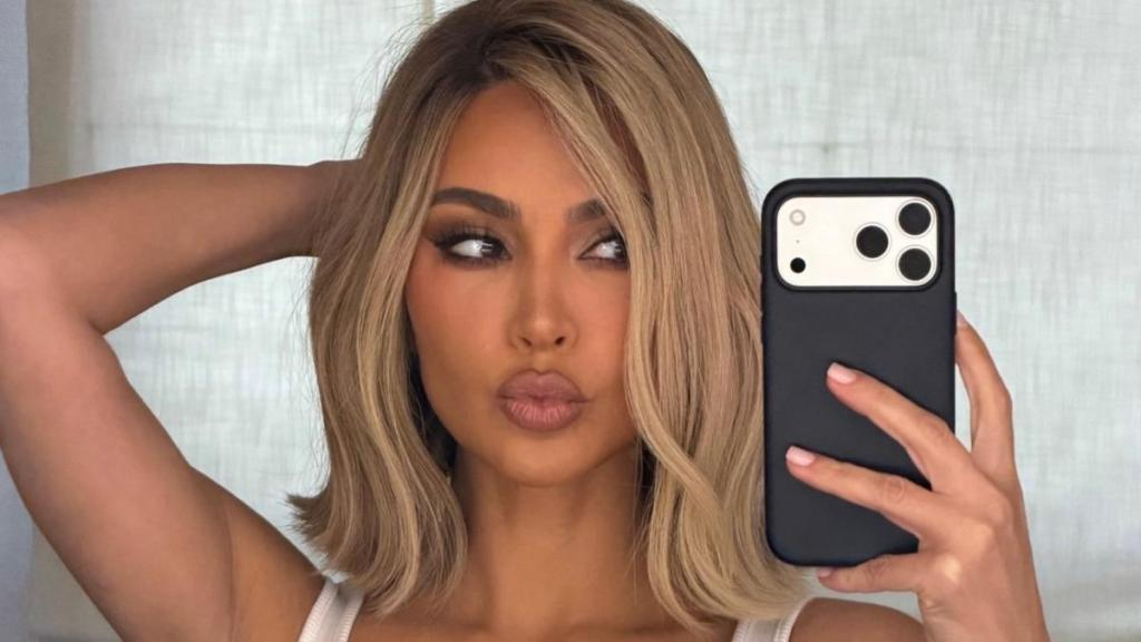 Kim Kardashian’s Skimpy String Bikini Top Barely Contains Her Curves