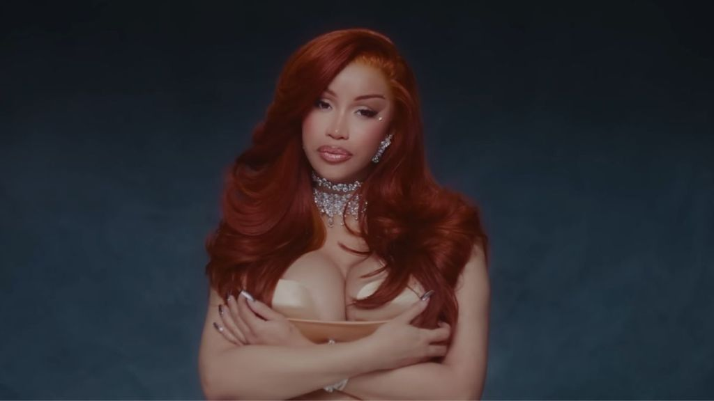 Cardi B Boldly Shows off Her Legs in a Tight Plunging Bodysuit That Hugs Every Curve