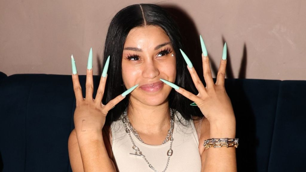 Cardi B’s Plunging Sports Bra Peeks Through Unzipped Top for Chipotle