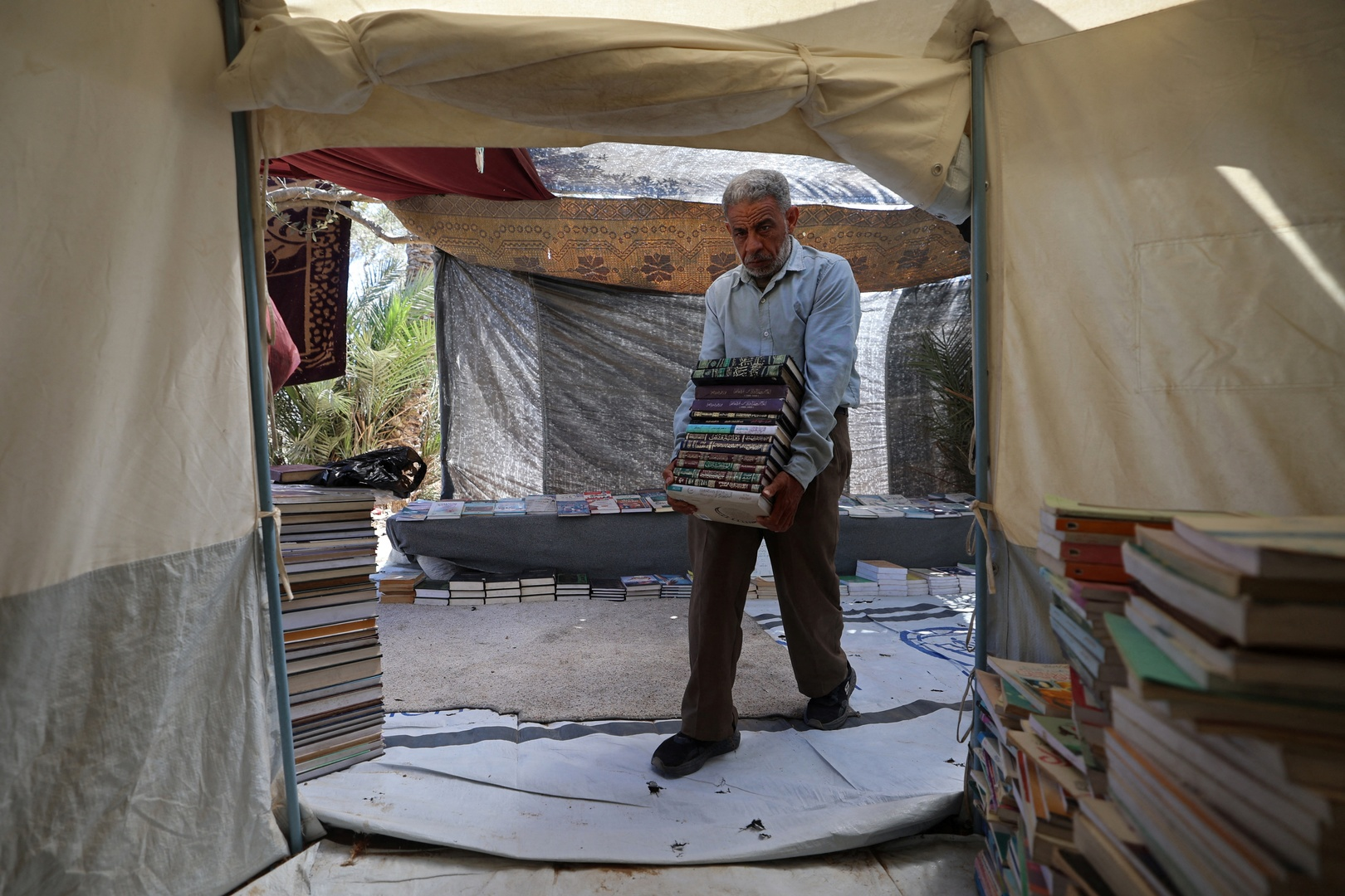 Gaza man builds roadside library from books buried in rubble