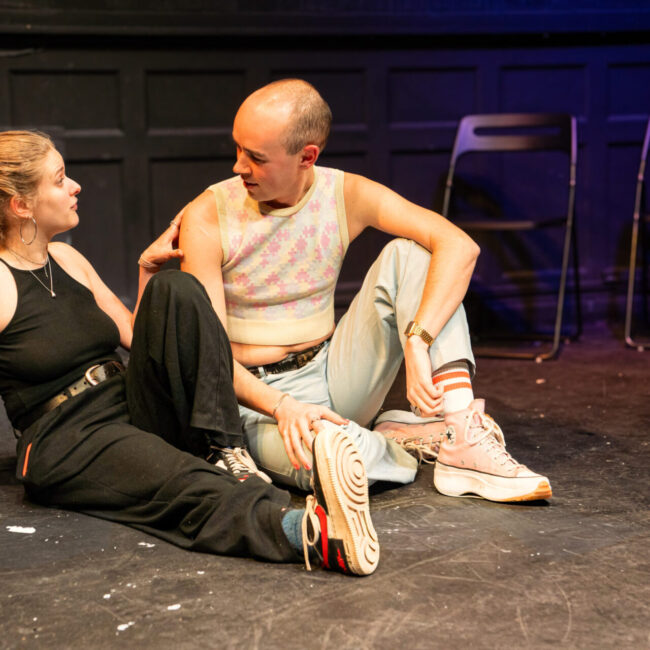 Queerguru’s Robert Malcolm reviews CRUISING entertaining woke romcom, by queer female theatre company Dreambite Collective