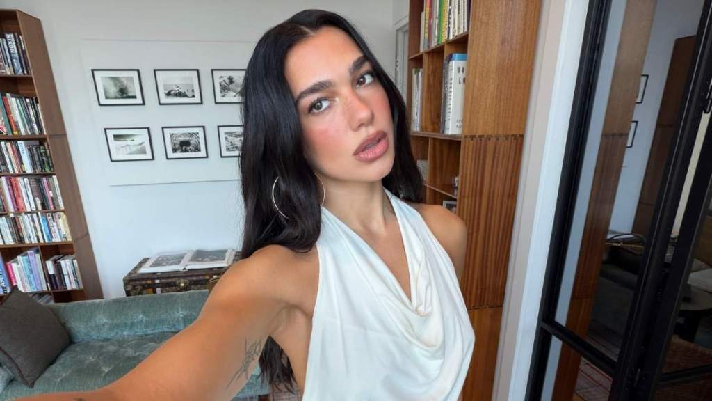 Dua Lipa’s Body-Hugging Fanci Club Top Puts Her Curves Front & Center