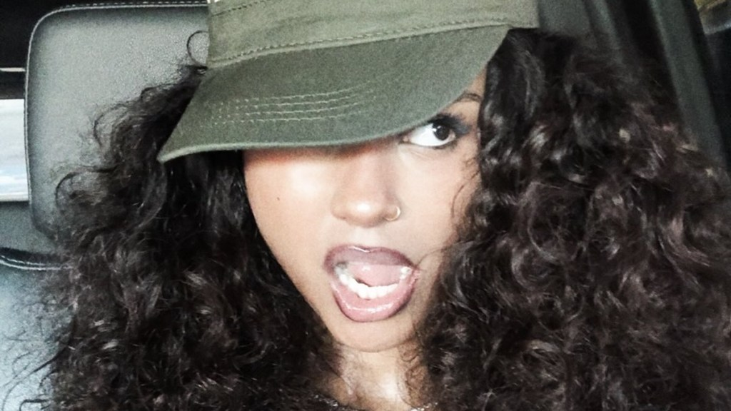 Tyla Adjusts Unbuttoned Jeans to Expose More of Her Bold Cutout Bodysuit