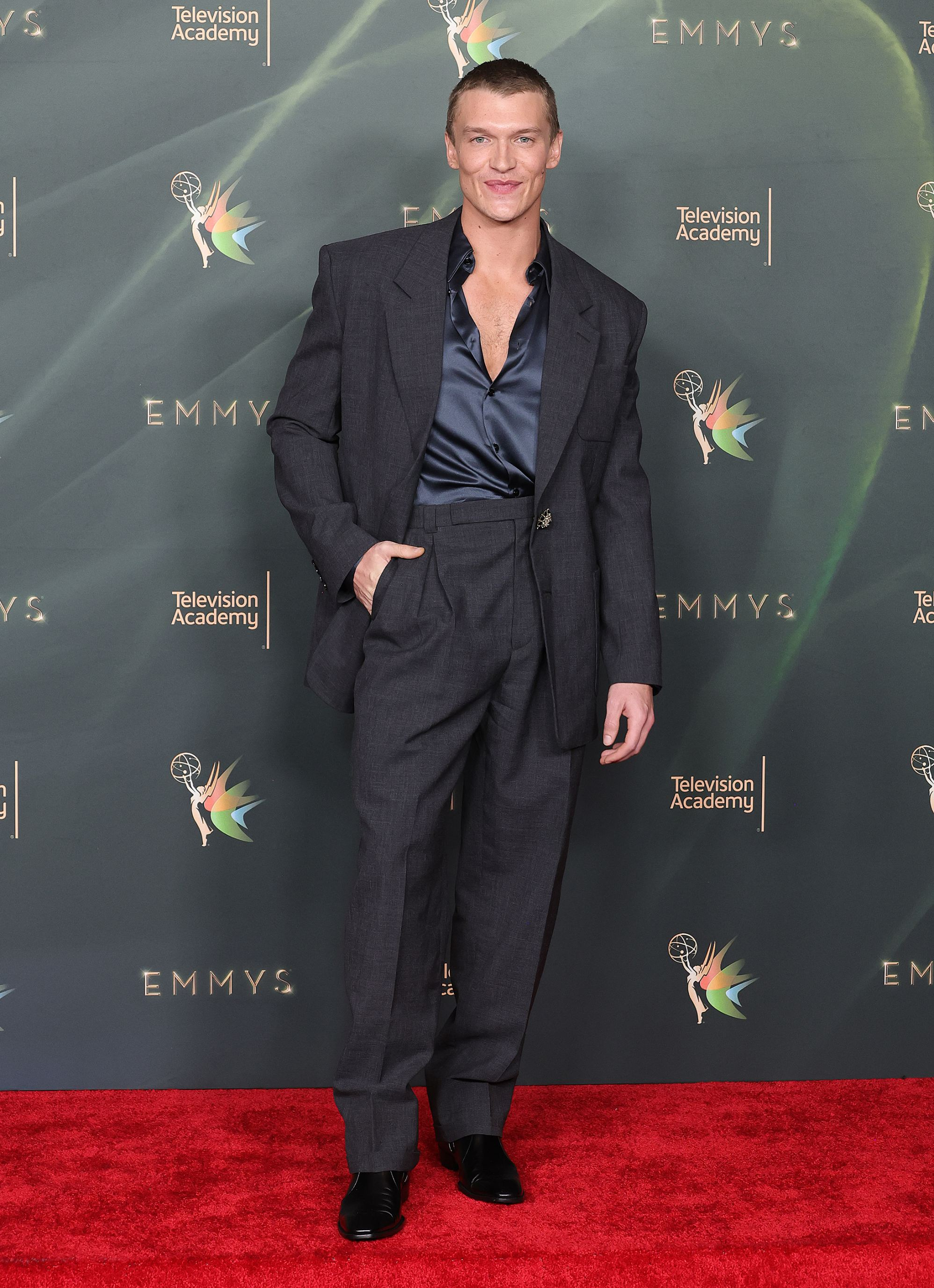 Heated Rivalry’s Connor Storrie walks Emmys red carpet with mum – and new hair