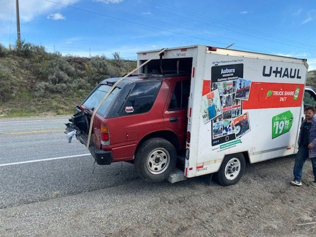 Cops Stop U-Haul Van with Isuzu Rodeo Hanging Out of Its Cargo Box