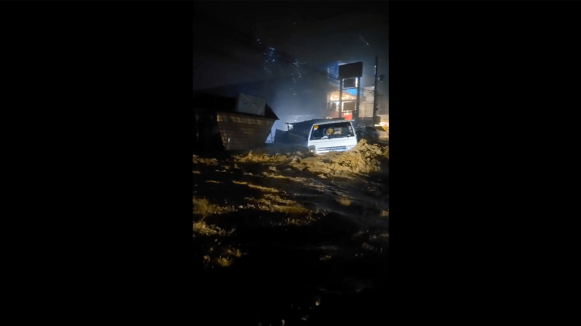 Video: Raging floodwaters sweep away lorry in the Philippines