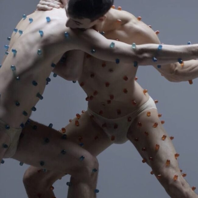 SWEATMEAT by  Bart Hess : two Bodies are locked in a fight choreography with a sweet prize